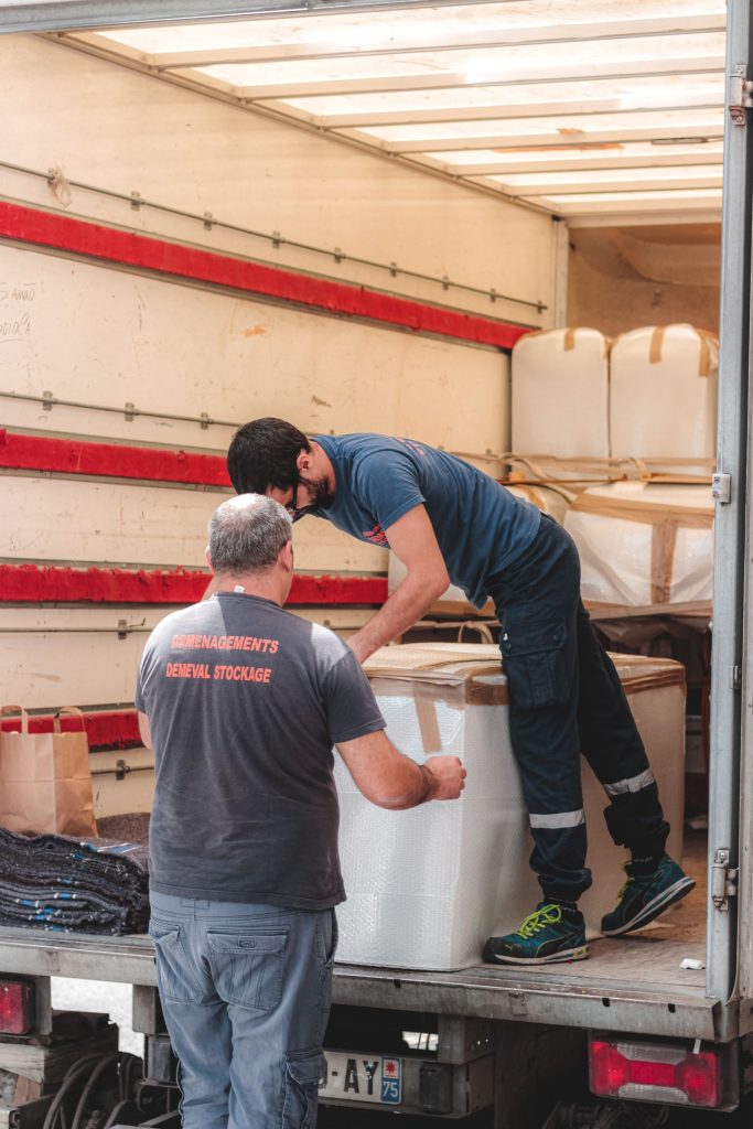 Legend Movers crew unloading a moving truck in Dallas, Texas